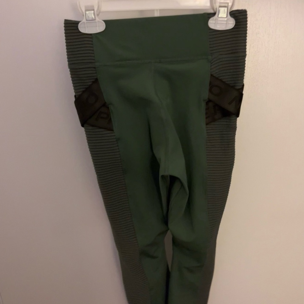 Green with black cross overs Nike leggings